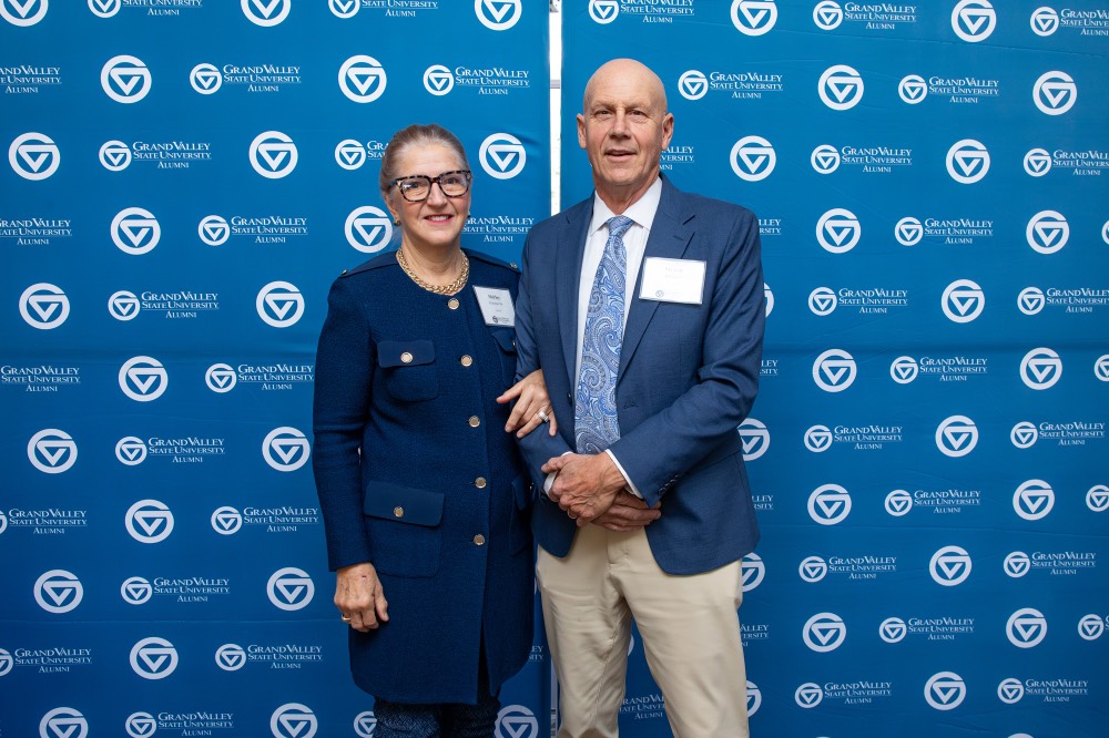 Man and women pose together